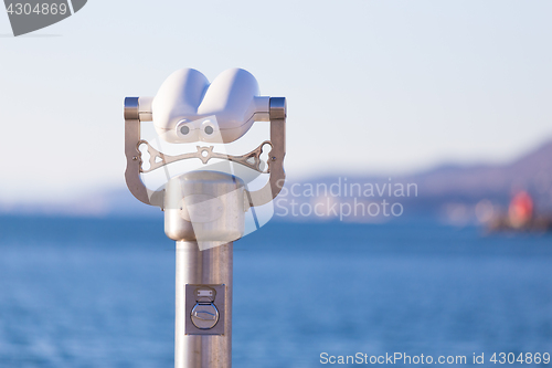 Image of Telescope on a shore.