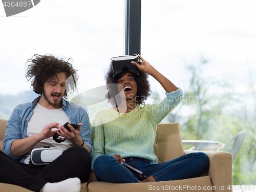 Image of Multiethnic Couple using virtual reality headset