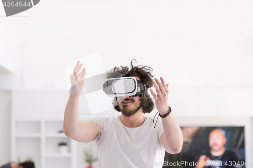 Image of man using VR-headset glasses of virtual reality