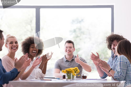 Image of multiethnic startup Group of young business people celebrating s