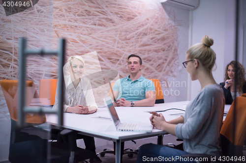 Image of Startup Business Team At A Meeting at modern night office buildi