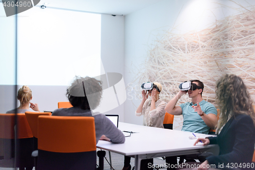 Image of startup business team using virtual reality headset
