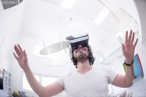 Image of man using VR-headset glasses of virtual reality