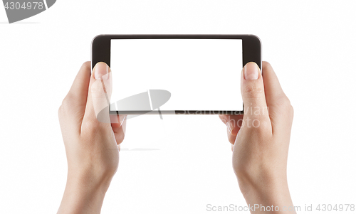 Image of Young girl hands holding black smart phone on white 