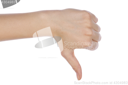 Image of Young girl hand signaling thumb down