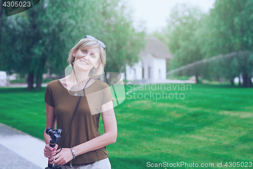 Image of Happy woman in a park