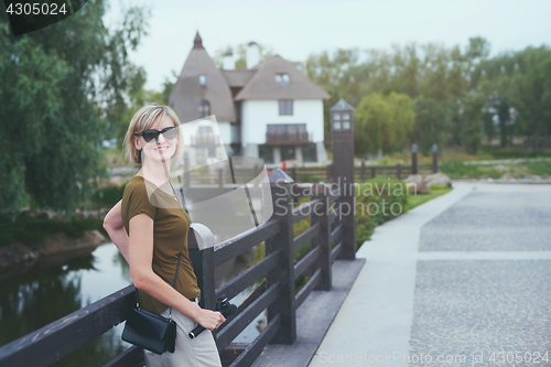 Image of Happy woman in a park