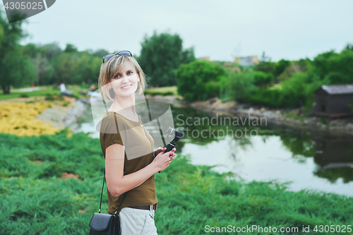 Image of Happy woman in a park