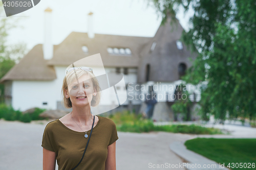 Image of Smiling woman outdoors