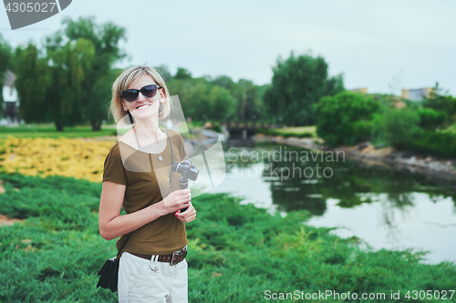 Image of Happy woman in a park