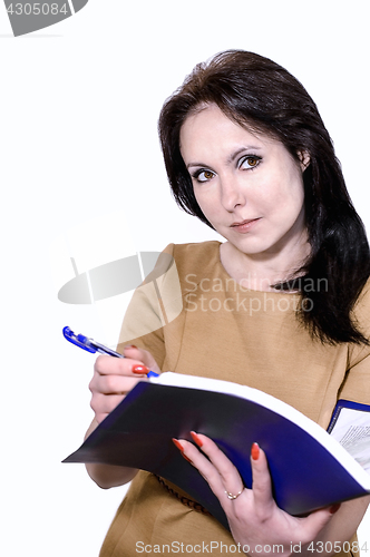 Image of Young business woman smiling with a folder of papers in hands