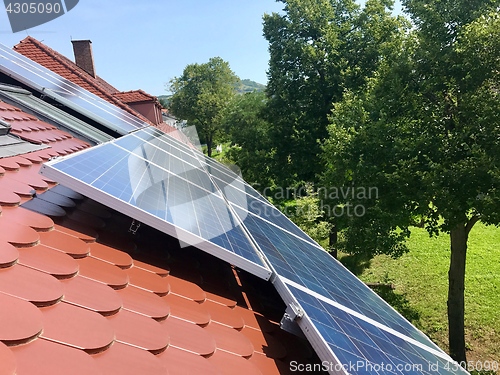 Image of House roof with solar panels on top