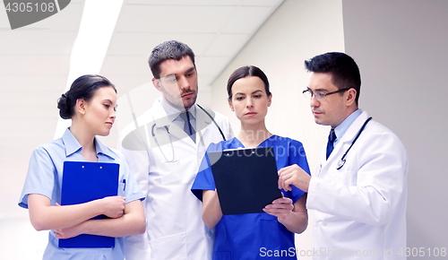 Image of group of medics at hospital with clipboard