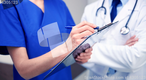 Image of close up of doctors with clipboard at hospital