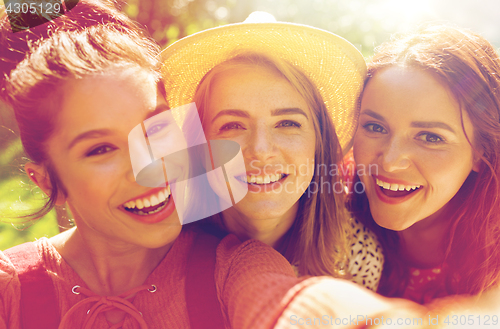 Image of happy women or friends taking selfie at summer