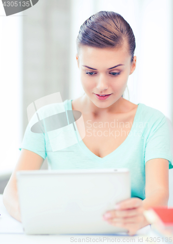 Image of smiling student girl with tablet pc