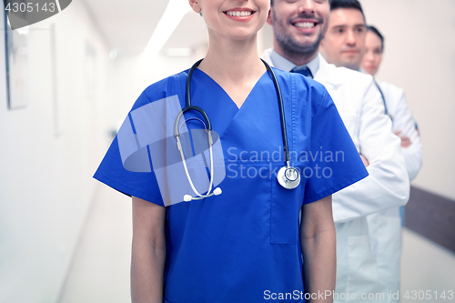 Image of close up of medics or doctors at hospital corridor