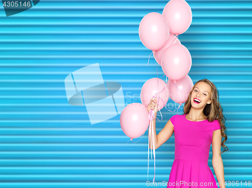 Image of happy young woman or teen girl in pink dress