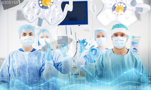 Image of group of surgeons in operating room at hospital