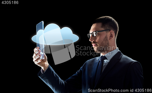 Image of businessman working with transparent tablet pc