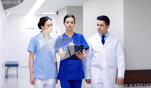 Image of group of medics at hospital with clipboard