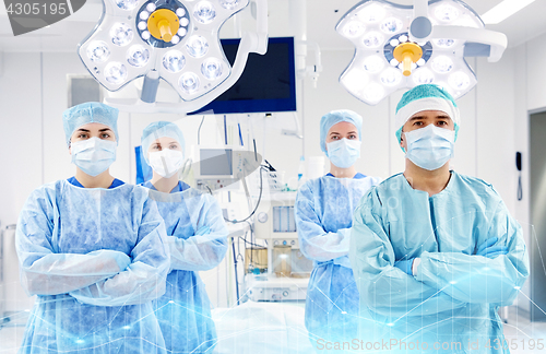 Image of group of surgeons in operating room at hospital