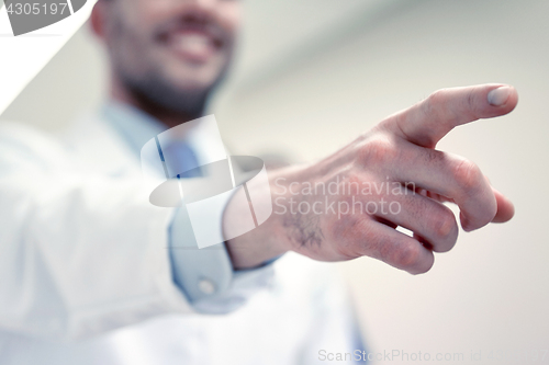 Image of close up of doctor pointing finger at hospital