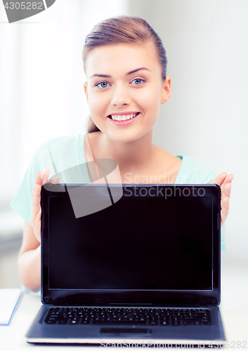 Image of smiling student girl with laptop