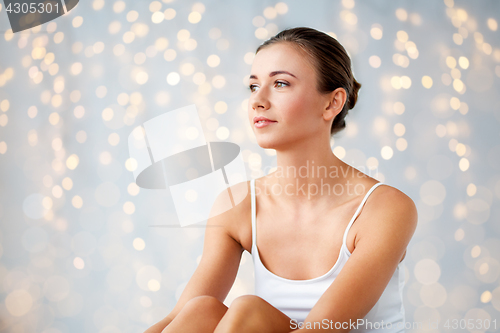 Image of beautiful happy young woman at home