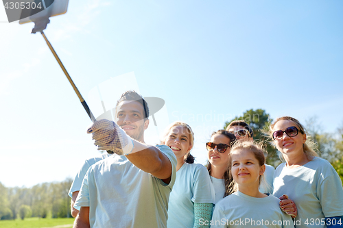 Image of group of volunteers taking smartphone selfie