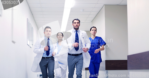 Image of group of medics walking along hospital