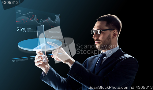 Image of businessman with tablet pc and virtual charts