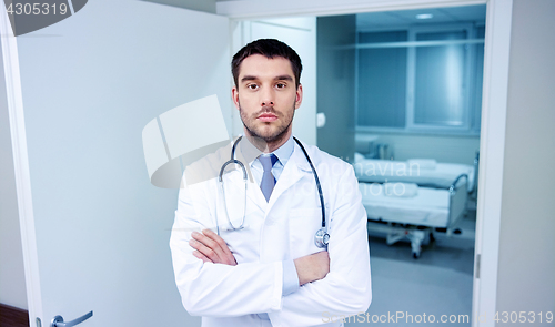 Image of doctor with stethoscope at hospital corridor