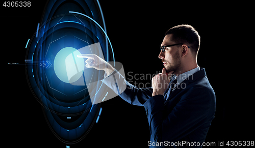 Image of businessman with virtual projection over black