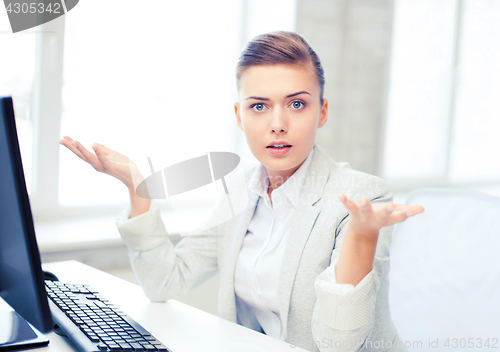 Image of stressed businesswoman with computer