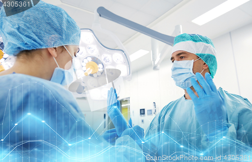 Image of surgeons in operating room at hospital