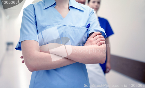 Image of close up of medics or doctors at hospital corridor