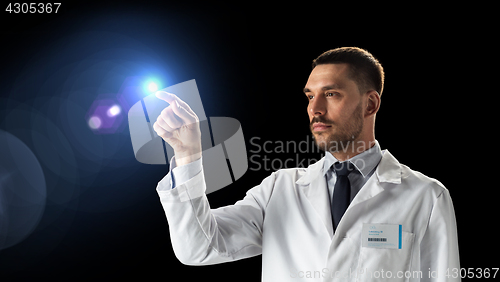 Image of doctor or scientist in white coat with light