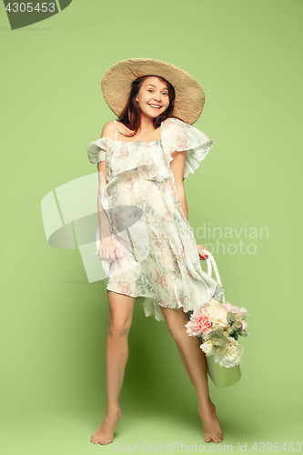 Image of Young beautiful pregnant woman standing on blue background