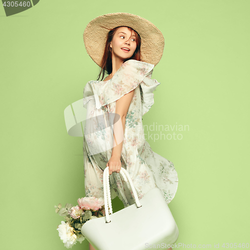 Image of Young beautiful pregnant woman standing on blue background