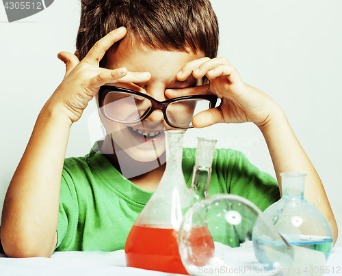 Image of little cute boy with medicine glass isolated