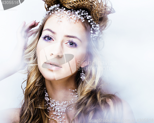 Image of beauty young snow queen in fairy flashes with hair crown on her head