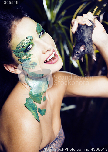 Image of woman with creative make up like snake and rat in her hands, halloween horror