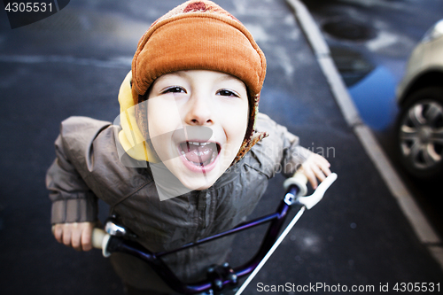 Image of little cute boy in hammock smiling