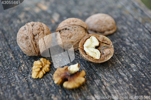 Image of Walnuts at old wooden plank