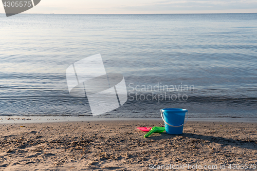 Image of Sand beach with plastic toys