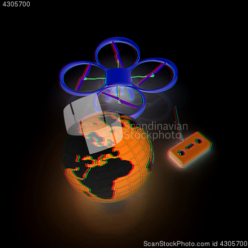 Image of Quadrocopter Drone with Earth Globe and remote controller on a w