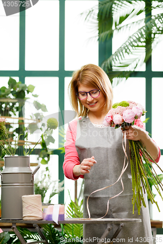 Image of Photo of girl with flowers