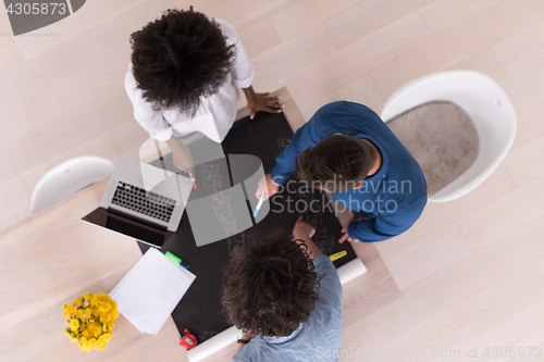 Image of top view of Multiethnic startup business team on meeting