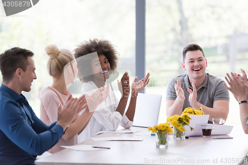 Image of multiethnic startup Group of young business people celebrating s